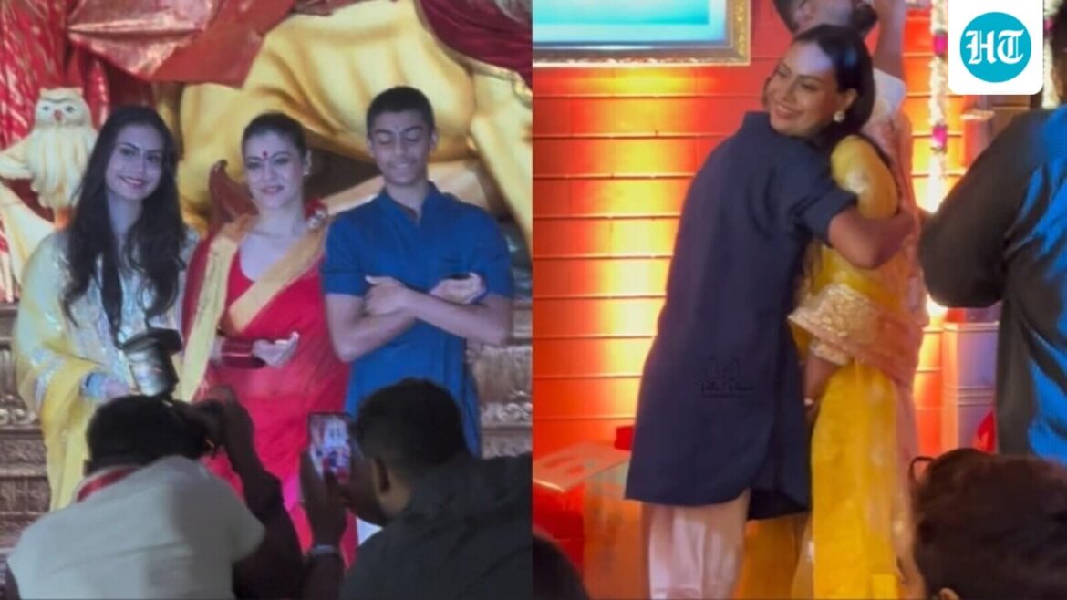 Kajol's son Yug kisses her, hugs sister Nysa while visiting Durga Puja pandal. Watch as they chat, then pose for pics