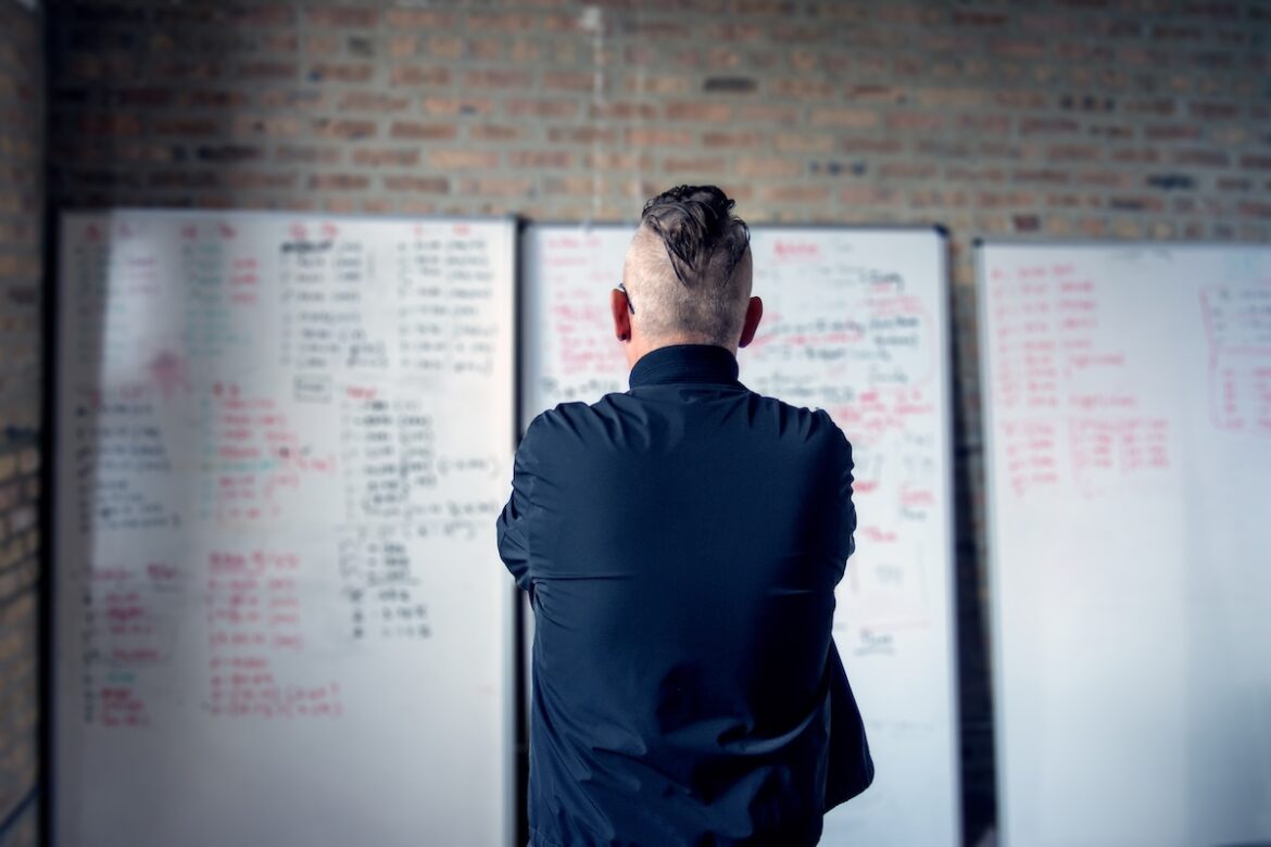 Riot Mike hard at work with his many whiteboards. (Photo courtesy of Riot Fest.)