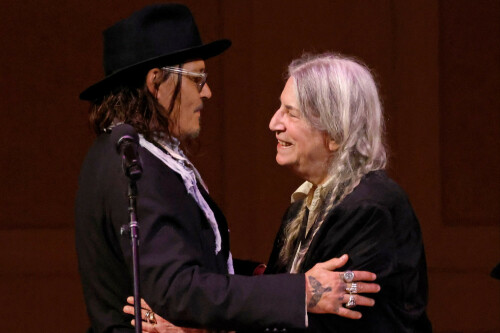 Johnny Depp joins Patti Smith on stage at London Palladium concert
